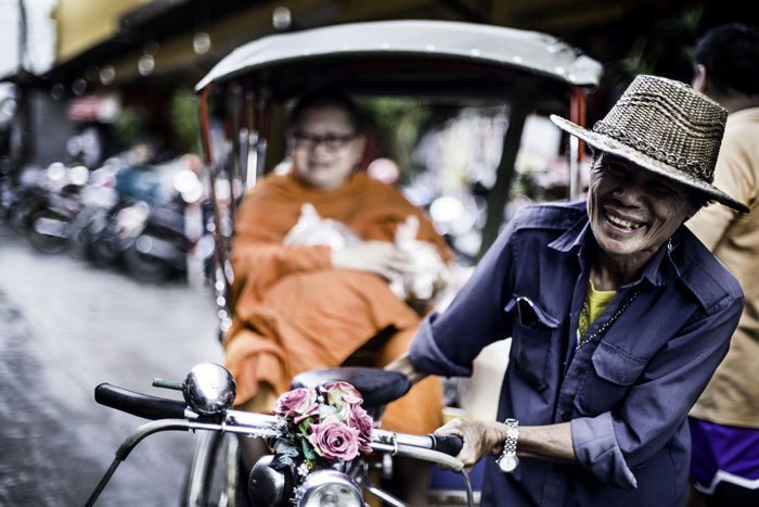 Tricycle taxi with a monk © Kevin Landwer-Johan