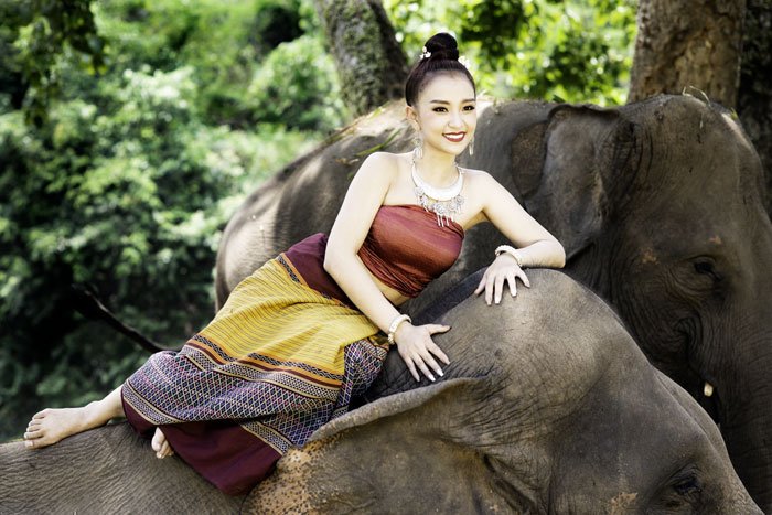 Thai Model Resting on an Elephant during a 5 day photography workshop