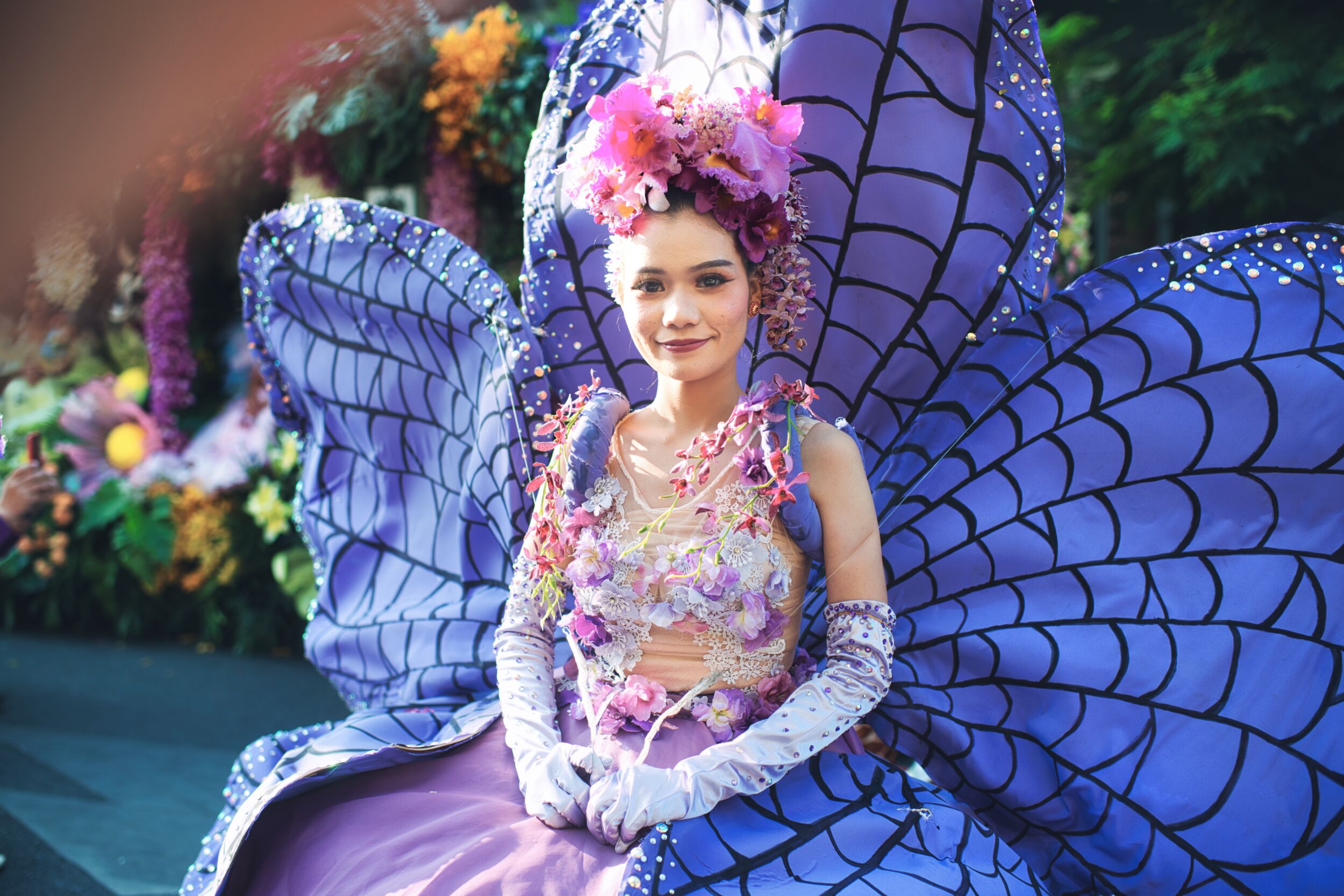 woman participating in the Chiang Mai flower festival parade